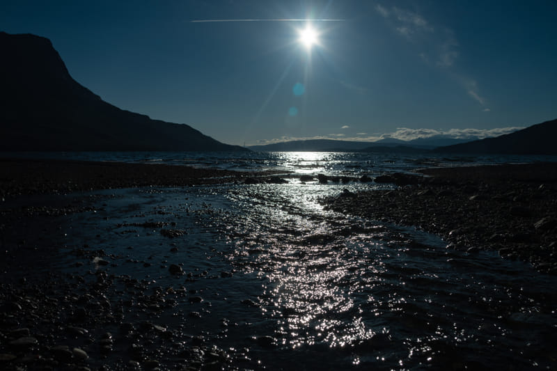 Midnight sun casting golden light over Iceland's landscape at 11pm