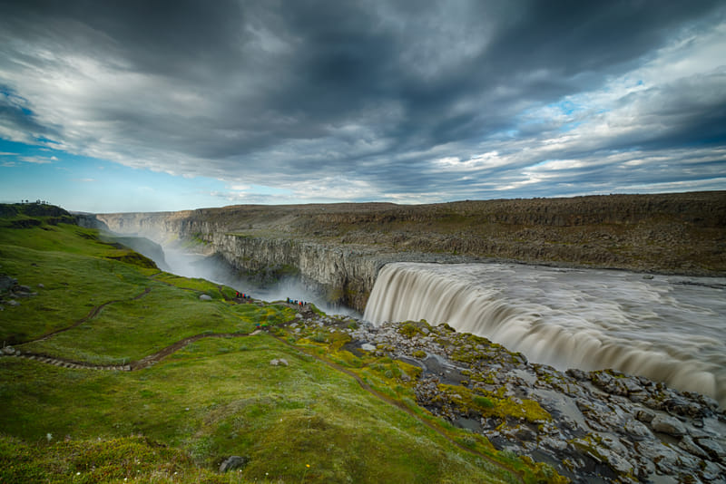 Dettifoss powerful waterfall in volcanic landscape