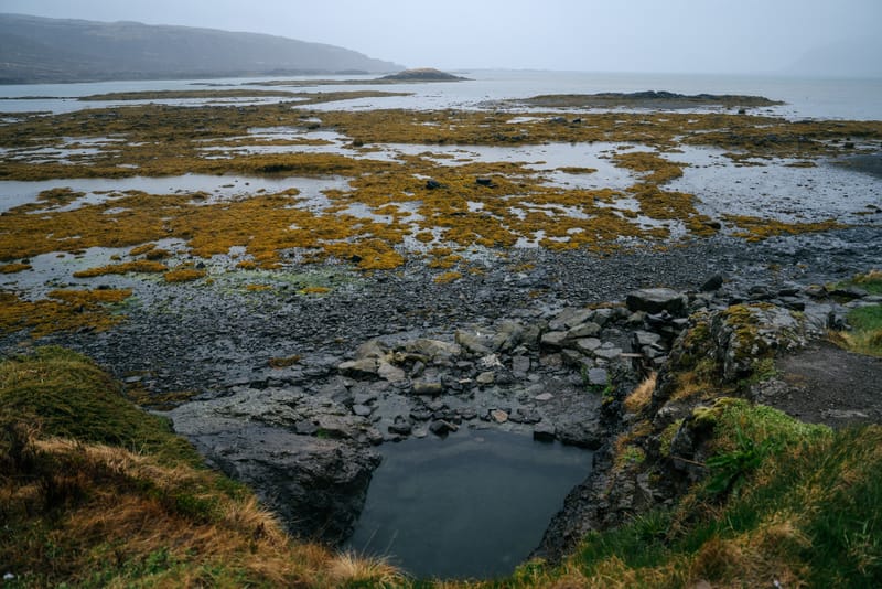 Hellulaug beachside hot spring in Westfjords