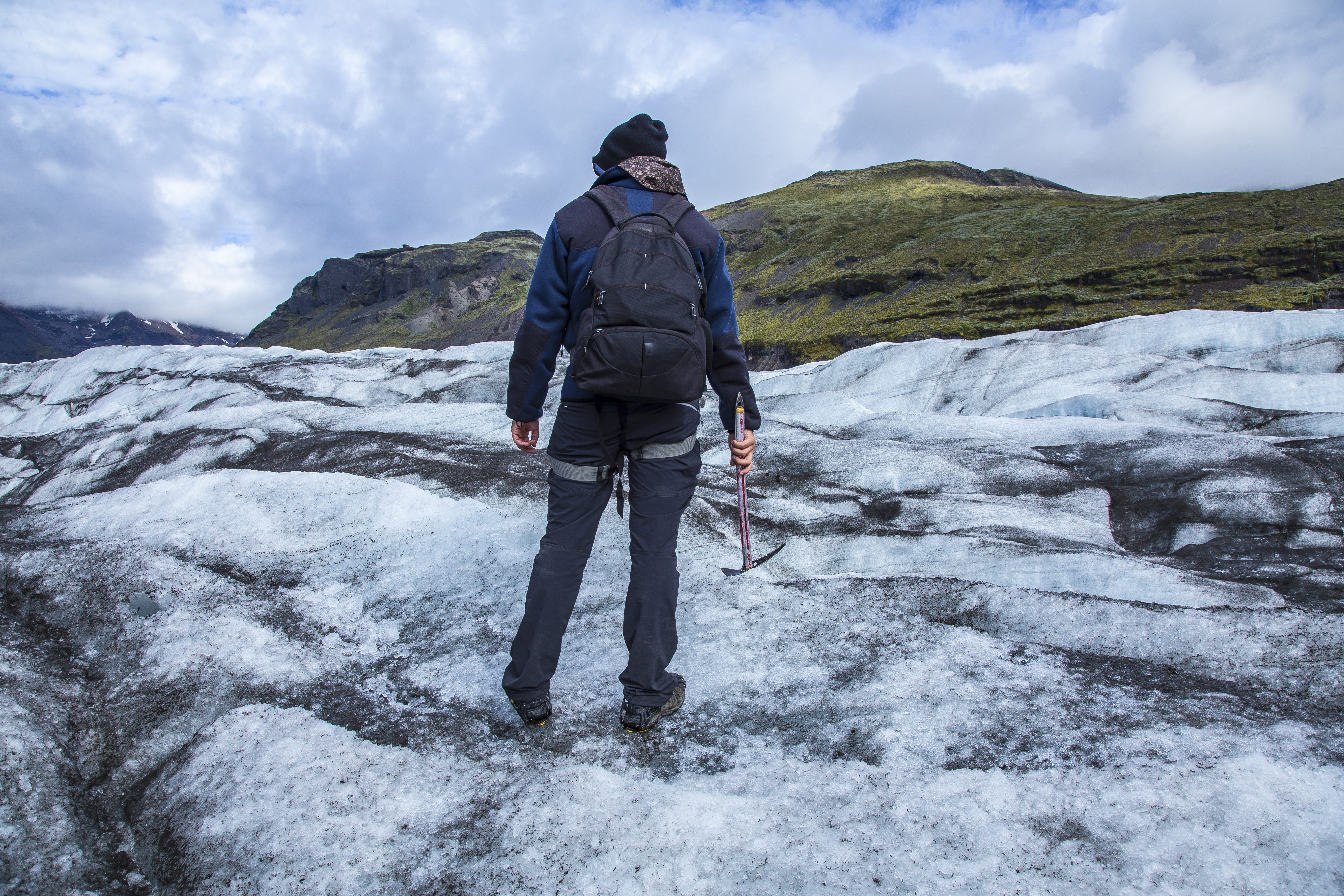 A young tourist on the ice of the Svinafellsjokull glacier Iceland